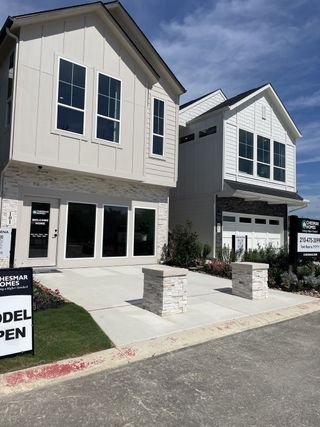Street view Modern homes with sleek exteriors and landscaped yards in Rose Hill by Chesmar Homes (San Antonio, TX).