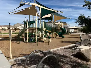 A vibrant community playground with modern equipment in Combs Ranch Discovery Collection by Taylor Morrison (Queen Creek, AZ).