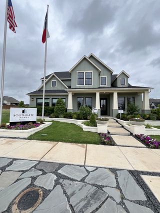 A charming modern home with lush landscaping in The Reserve at Watters by Southgate Homes, Allen, TX.