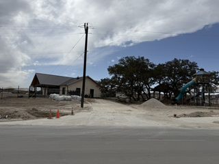 A developing community park with a playground in Riverstone at Westpointe by D.R. Horton, San Antonio, TX.