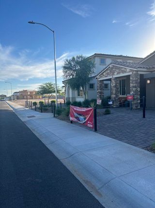 A charming stone-accented home in Allen Ranches: Fiesta Collection by Taylor Morrison, Litchfield Park, AZ.