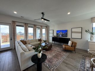 Living Room – A modern living space with floor-to-ceiling windows and backyard access.
