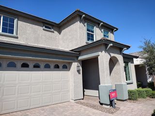 A charming two-story home with a modern garage and elegant entry in Paradisi Venture II Collection by Taylor Morrison (Surprise, AZ).