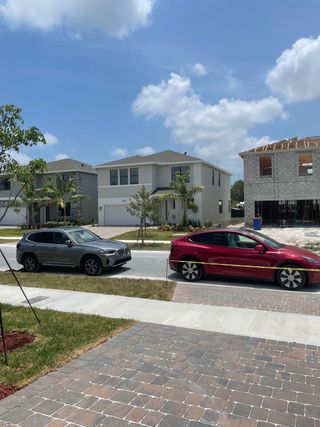 Modern homes with tidy yards and ongoing construction in the Rosemont community by D.R. Horton, Miami, FL.