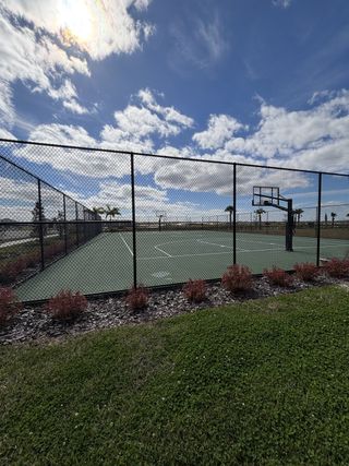 A well-maintained sports court with lush landscaping in Cypress Bay West Freedom by D.R. Horton (Palm Bay, FL).