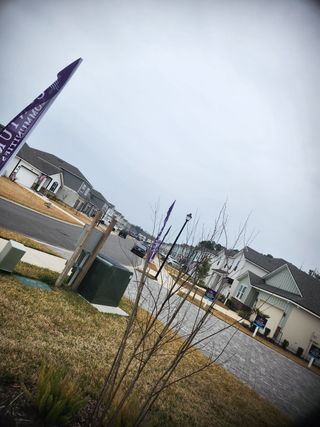 Charming neighborhood with modern homes in Pine Series at The Landings at Pecan Park by Century Communities (Jacksonville, FL).