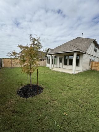 A charming home with a spacious backyard in The Parklands by Coventry Homes (Schertz, TX).