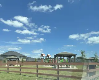 Charming playground and gazebo under a clear sky in Rosehill Meadow by Colina Homes (Tomball, TX).