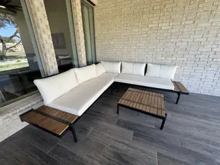 Model Home A stylish covered patio dining space, perfect for enjoying outdoor meals.