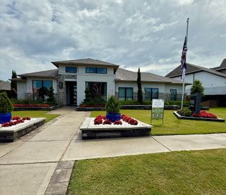 Street view A beautiful modern home with landscaped gardens in Fulbrook on Fulshear Creek 60' by Perry Homes (Fulshear, TX).