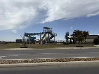 A thrilling waterslide park in Riverstone at Westpointe by D.R. Horton, nestled in the vibrant community of San Antonio, TX.