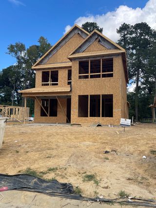 A new home under construction, showcasing its framework in Sweetgrass Station by Dream Finders Homes (Summerville, SC).