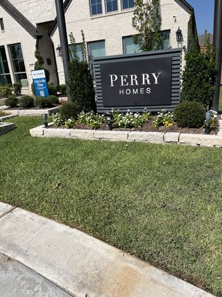 Elegant brick home with manicured landscaping in Marvida 45' - Gated by Perry Homes (Cypress, TX).