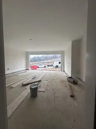 Model Home A spacious unfinished garage with wide entry and natural light, ready for customization.
