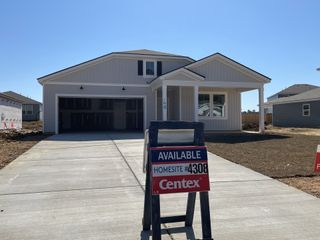 Newly built home with garage and covered porch in Bradford Pointe by Centex (Summerville, SC).