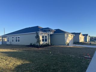 A charming single-story home with a spacious yard in Millwood: Millwood Estates - The Meadows by Lennar (Ocala, FL).