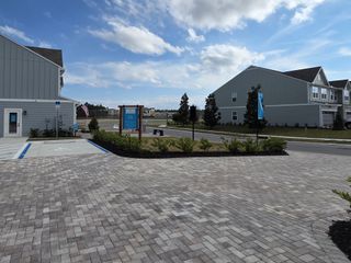 A modern facade and neat landscaping in Shearwater Townhomes by Ryan Homes, St. Augustine, FL.