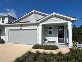 A charming home with a spacious garage and manicured landscaping in RiverTown - Meadows by Mattamy Homes (St. Johns, FL).