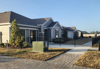Street view Attractive gray home with a manicured lawn and modern design in Hawkes Meadow by KB Home (Jacksonville, FL).