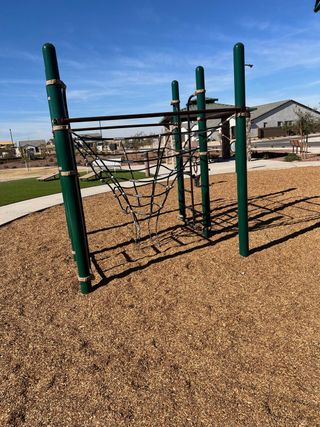 A playground with climbing structures in The Grove at El Cidro by William Ryan Homes, Goodyear, AZ.