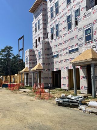 Street view A modern construction site at Walk at Park Circle by CK Development in North Charleston, SC, showcasing ongoing building progress.