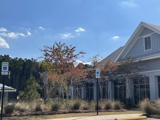 A beautiful community center with lush landscaping at Del Webb Charleston at Nexton by Del Webb (Summerville, SC).