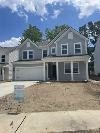 A charming gray home with a two-car garage in Stono Village by K. Hovnanian® Homes (Hollywood, SC).