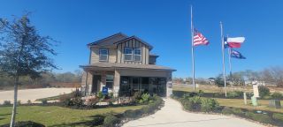 A charming two-story home with manicured landscaping in Preserve at Medina by D.R. Horton (Von Ormy, TX).