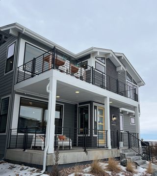 A modern two-story home with sleek railings and porch in Legends at Lyric by Shea Homes (Lone Tree, CO).