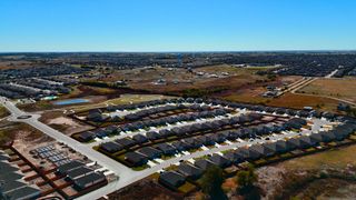 A beautifully planned neighborhood with winding streets and modern homes in The Villages at Schwertner Ranch by D.R. Horton (Jarrell, TX).