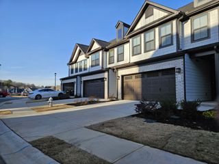 Street view Charming modern townhomes with elegant design in Village Towns by Ryan Homes (Fayetteville, GA).