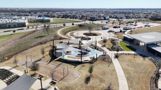 Community Amenities A scenic community park with modern design in Easton Park by Pacesetter Homes (Austin, TX).