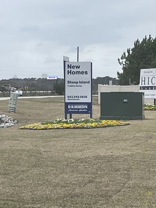 Street view Discover new homes at Sheep Island by D.R. Horton, nestled in lush landscaping in Summerville, SC.