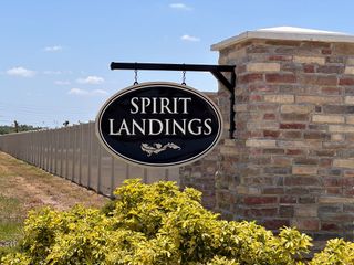 A welcoming entrance to the Spirit Landings community by KB Home (Winter Haven, FL).