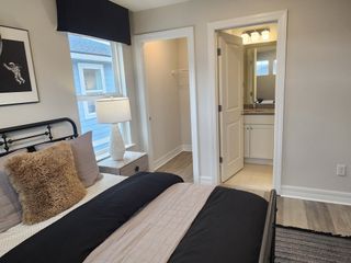 A unique space-themed bedroom with celestial decor, dark accent tones, and a private en-suite bathroom.