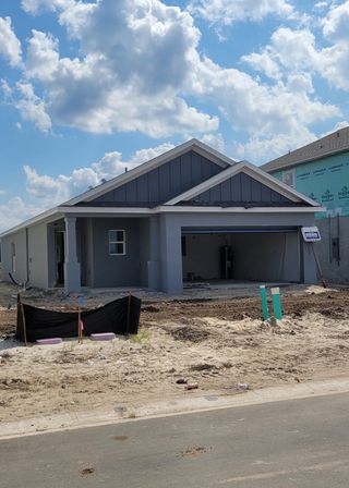 A charming new build with a gable roof and garage in Westview: Aden South III by Lennar (Kissimmee, FL).