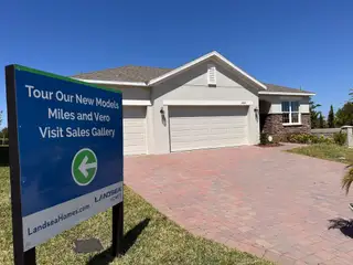 A charming single-story home with a brick driveway in Ridgeview by Landsea Homes (Clermont, FL).