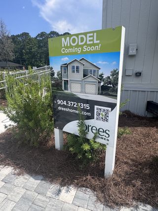 Street view Model home coming soon at Baxley Villas by Drees Custom Homes in Middleburg, FL. Anticipate beautiful design and quality.