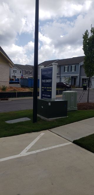 Street view Modern homes and clear skies in The Emery, Villa Rica, GA by Starlight Homes.