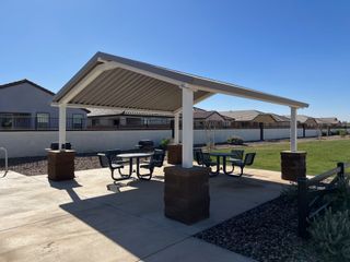 A cozy picnic area under a shaded pavilion in Anderson Farms: Arbor by Lennar, Maricopa, AZ.