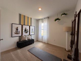 A serene flex room with a modern design, plush carpeting, and a calming ambiance—perfect for yoga, meditation, or a reading nook.