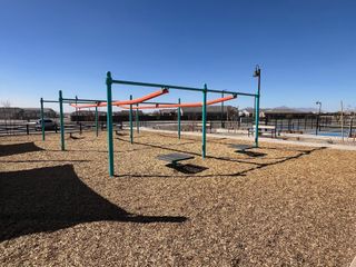 Community Amenities A vibrant playground with shade and seating in Rancho Mirage Signature Series by Meritage Homes, Maricopa, AZ.