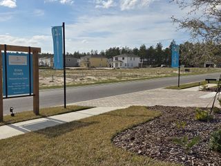 A developing neighborhood view in Shearwater by Ryan Homes, featuring modern residences in St. Augustine, FL.