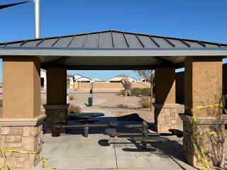 Community Amenities A scenic gazebo in a landscaped community area at The Lakes at Rancho El Dorado by Brightland Homes (Maricopa, AZ).