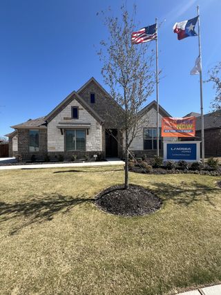 A charming brick home with tidy landscaping in Massey Meadows Phase 2 by Landsea Homes (Midlothian, TX).