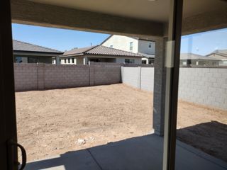Model Home A fenced backyard with a blank canvas, ready for landscaping and creativity.