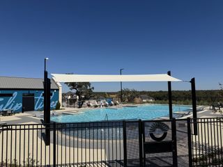 Community Amenities A serene community pool with modern amenities in Nolina by Chesmar Homes, Georgetown, TX.