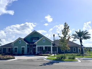 A charming community center with manicured landscaping in Edenbrooke at Hyland Trail by Lennar (Green Cove Springs, FL).