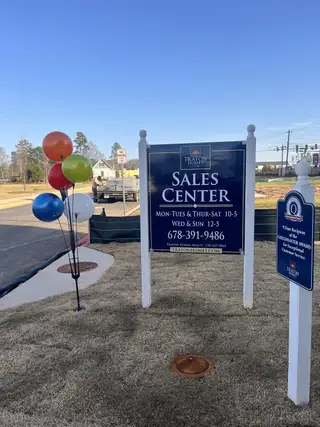 A welcoming sales center with colorful balloons at Wilkins Walk by Traton Homes, Mableton, GA.