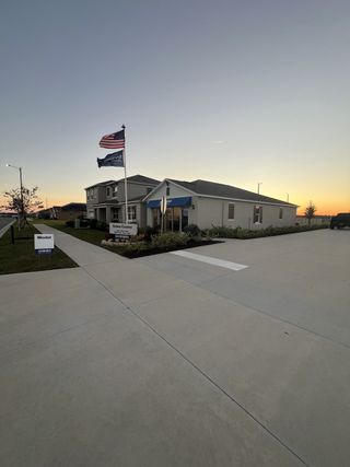 A welcoming sales center at sunset in Eden Hills by D.R. Horton, Lake Alfred, FL.
